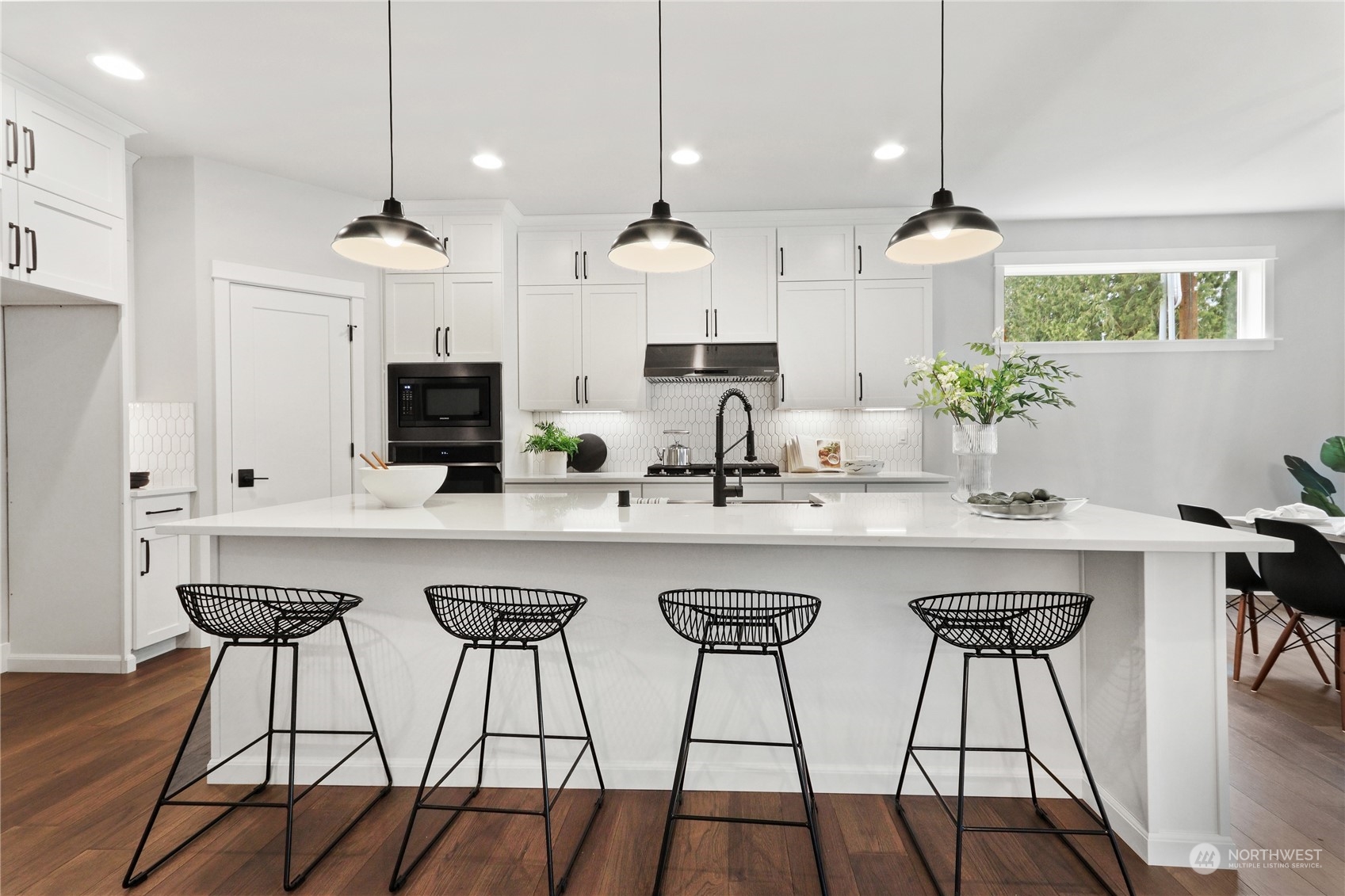 3915 211th Place Southeast Bothell, WA 98021 - Photo 10 of 24 a kitchen with stainless steel appliances kitchen island a large island in the center and cabinets