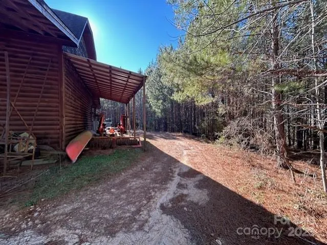 a view of empty field with trees