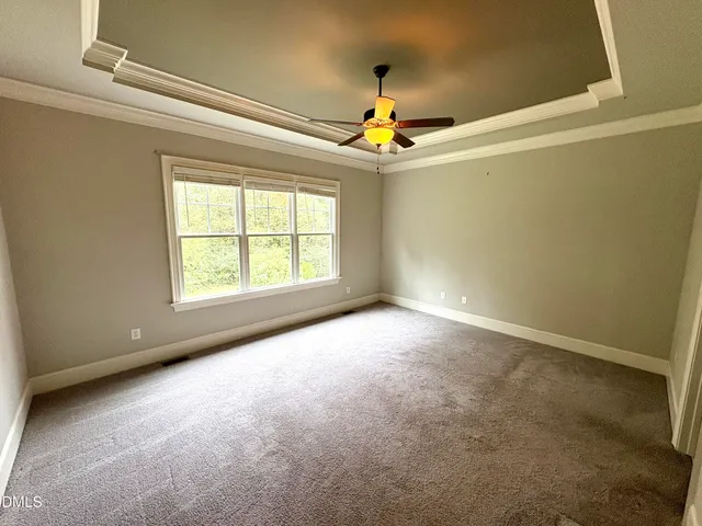 a bathroom with a granite countertop double vanity sink and mirror