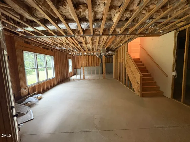 a view of field with trees in the background