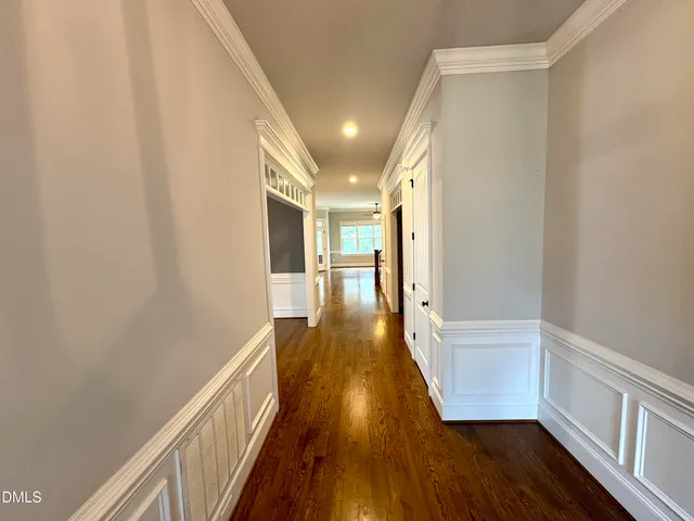 a view of gallery with wooden floor