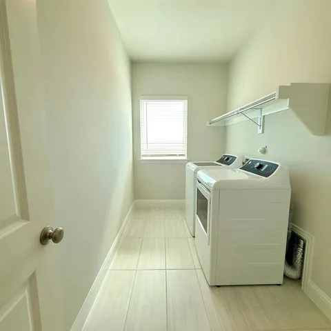 a utility room with dryer and washer