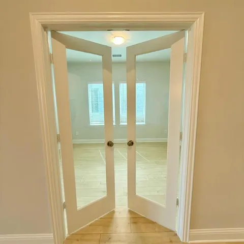 a view of a bathroom from a hallway