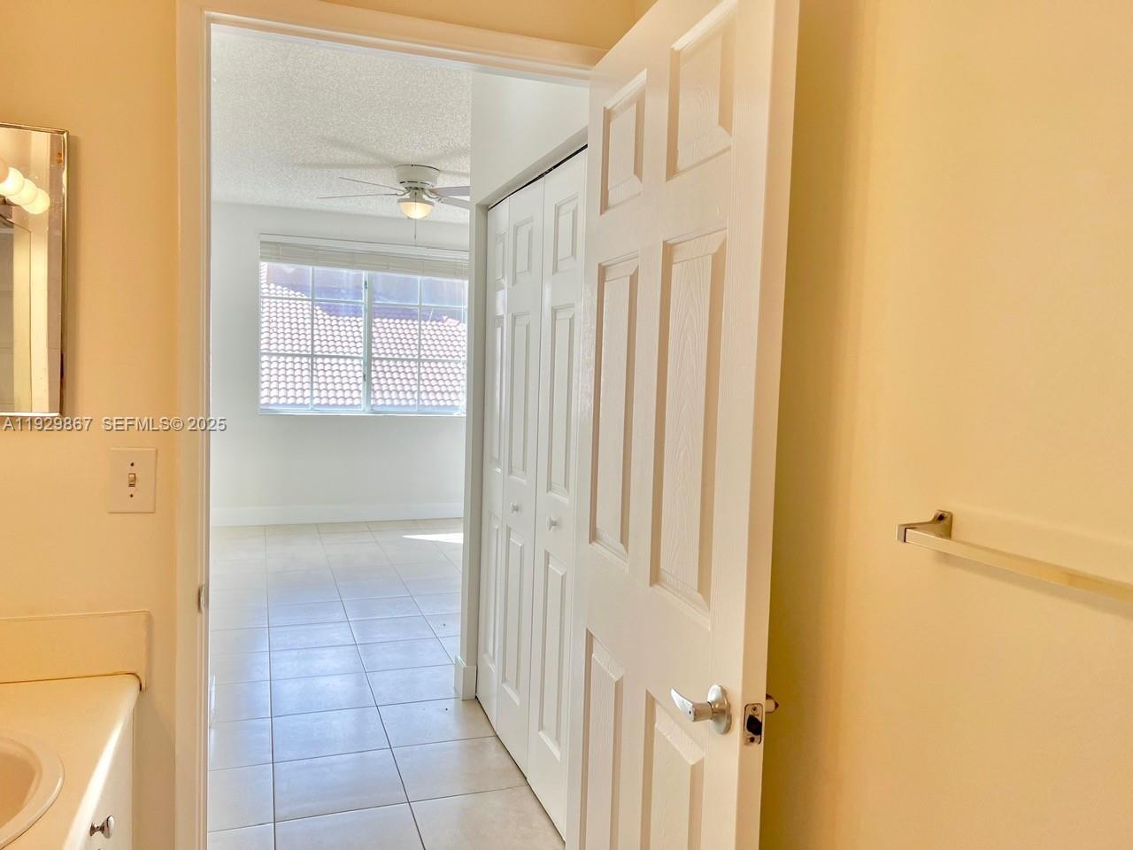8000 North Nob Hill Road, Unit 204 Tamarac, FL 33321 - Photo 11 of 27 a bathroom with a shower and a glass door