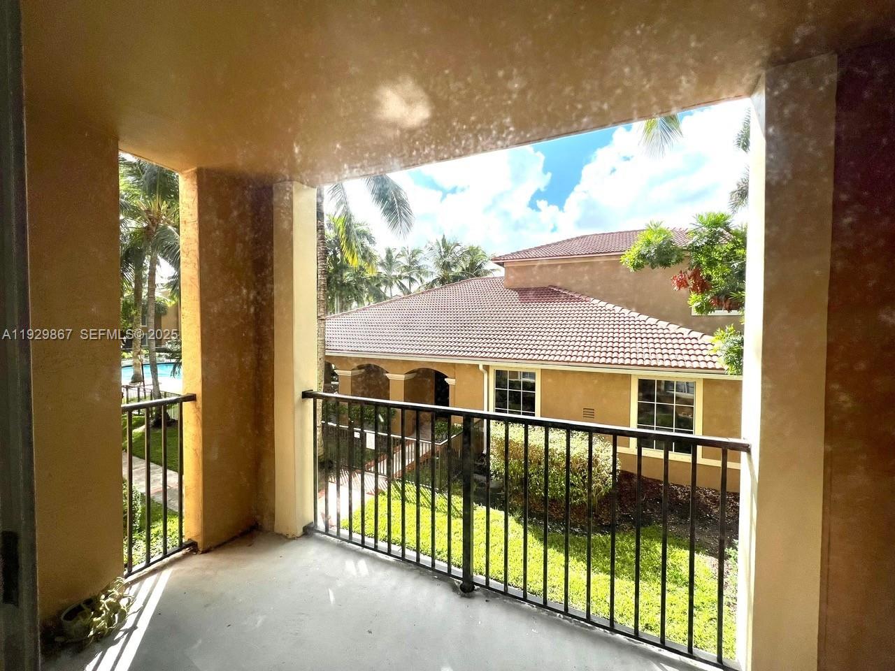 8000 North Nob Hill Road, Unit 204 Tamarac, FL 33321 - Photo 14 of 27 a view of a large window with a balcony