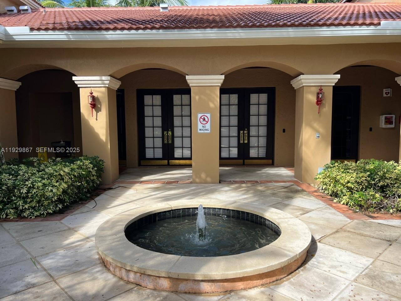 8000 North Nob Hill Road, Unit 204 Tamarac, FL 33321 - Photo 22 of 27 a front view of a house