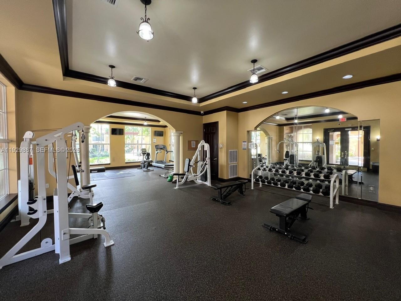 8000 North Nob Hill Road, Unit 204 Tamarac, FL 33321 - Photo 23 of 27 a room with gym equipment