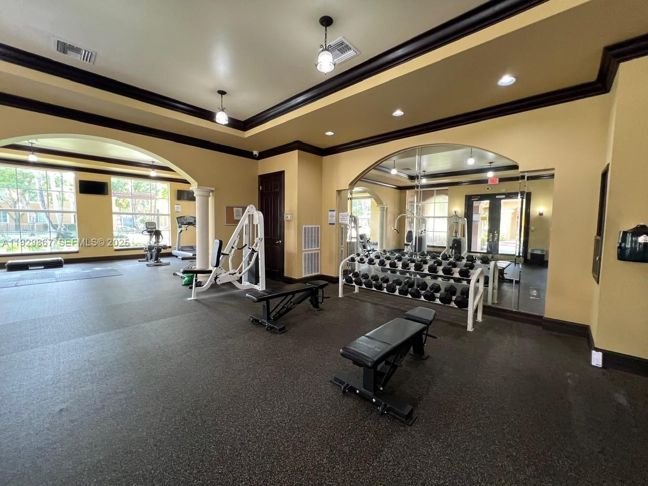 8000 North Nob Hill Road, Unit 204 Tamarac, FL 33321 - Photo 27 of 27 a view of a room with gym equipment