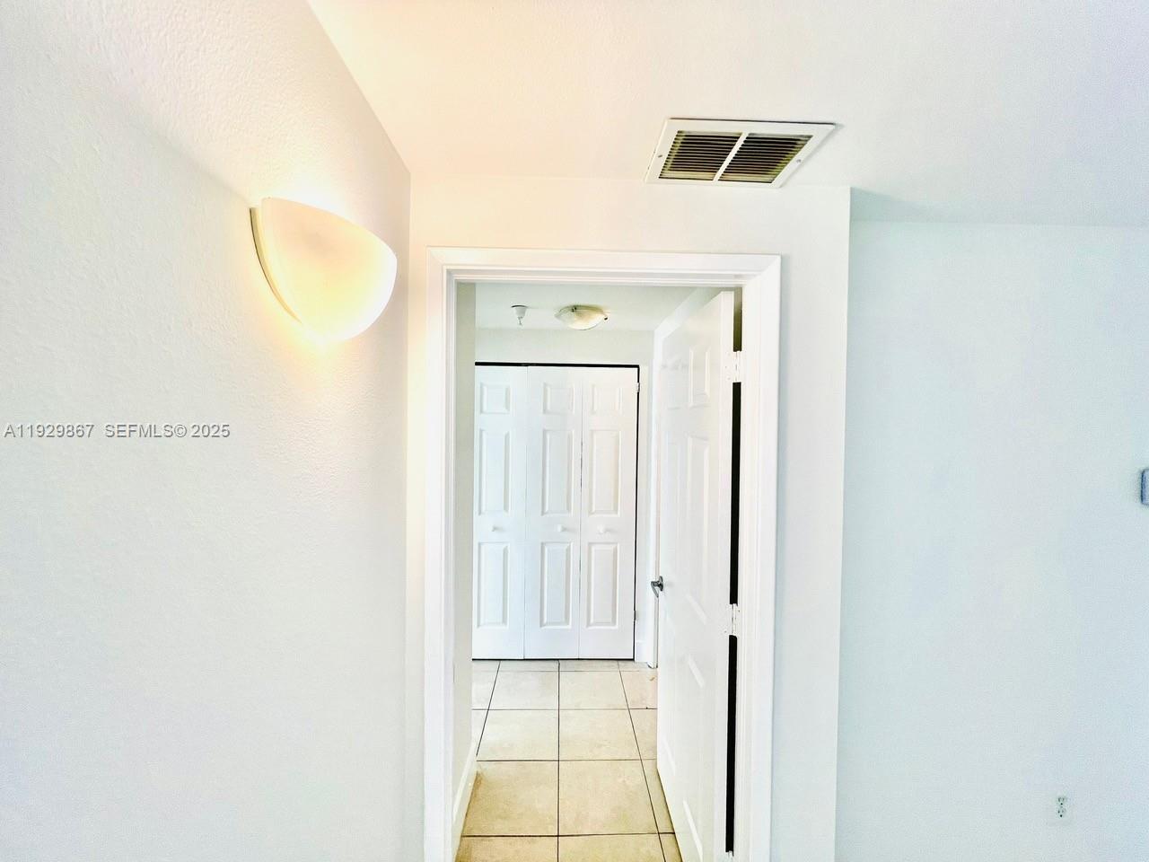 8000 North Nob Hill Road, Unit 204 Tamarac, FL 33321 - Photo 6 of 27 a view of a hallway with wooden floor