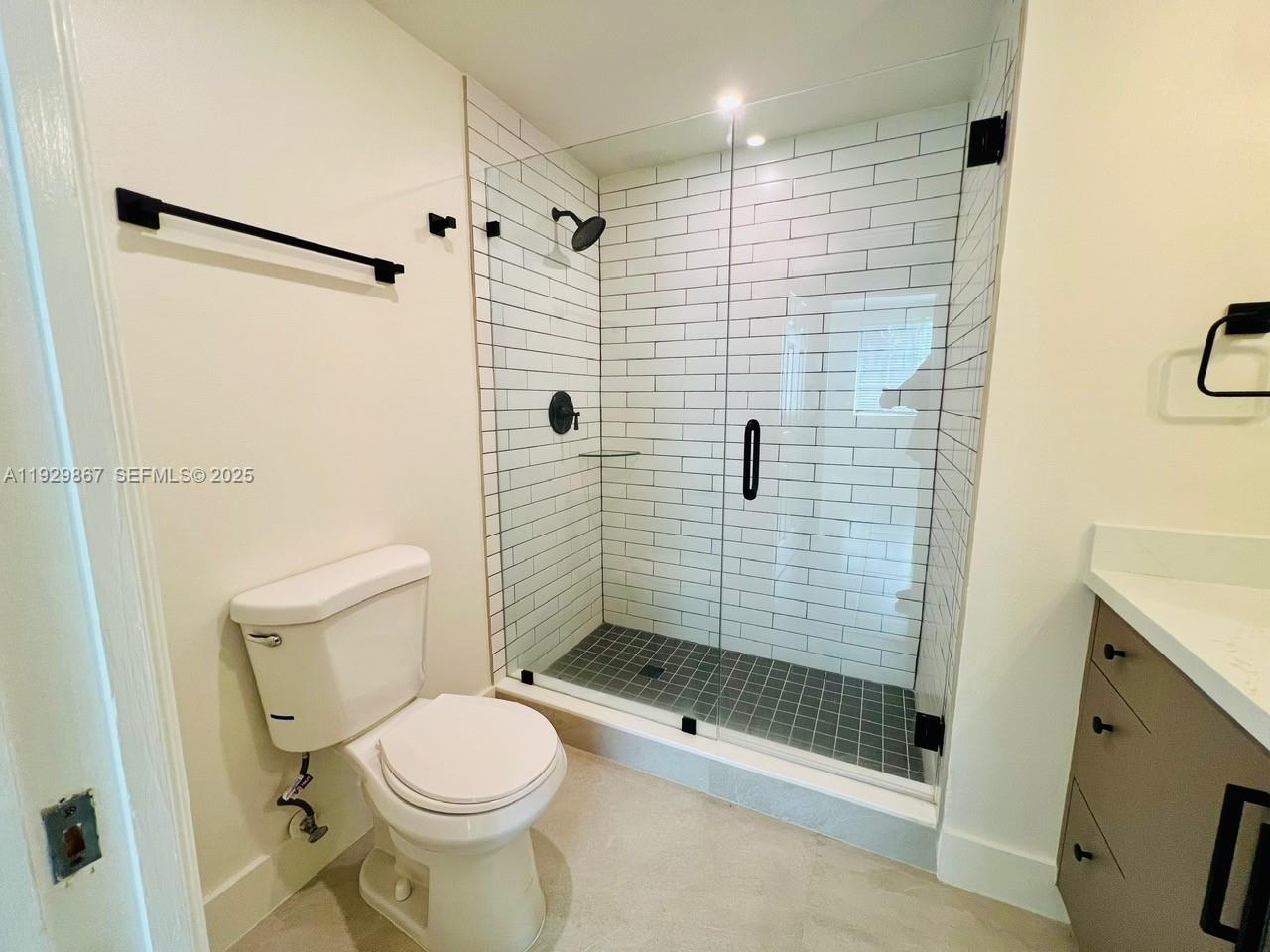 8000 North Nob Hill Road, Unit 204 Tamarac, FL 33321 - Photo 8 of 27 a bathroom with a shower a toilet and a sink