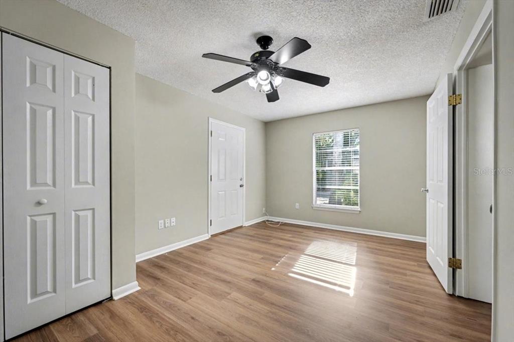 173 North Ridgewood Avenue Ormond Beach, FL 32174 - Photo 21 of 33 a view of empty room with wooden floor and window