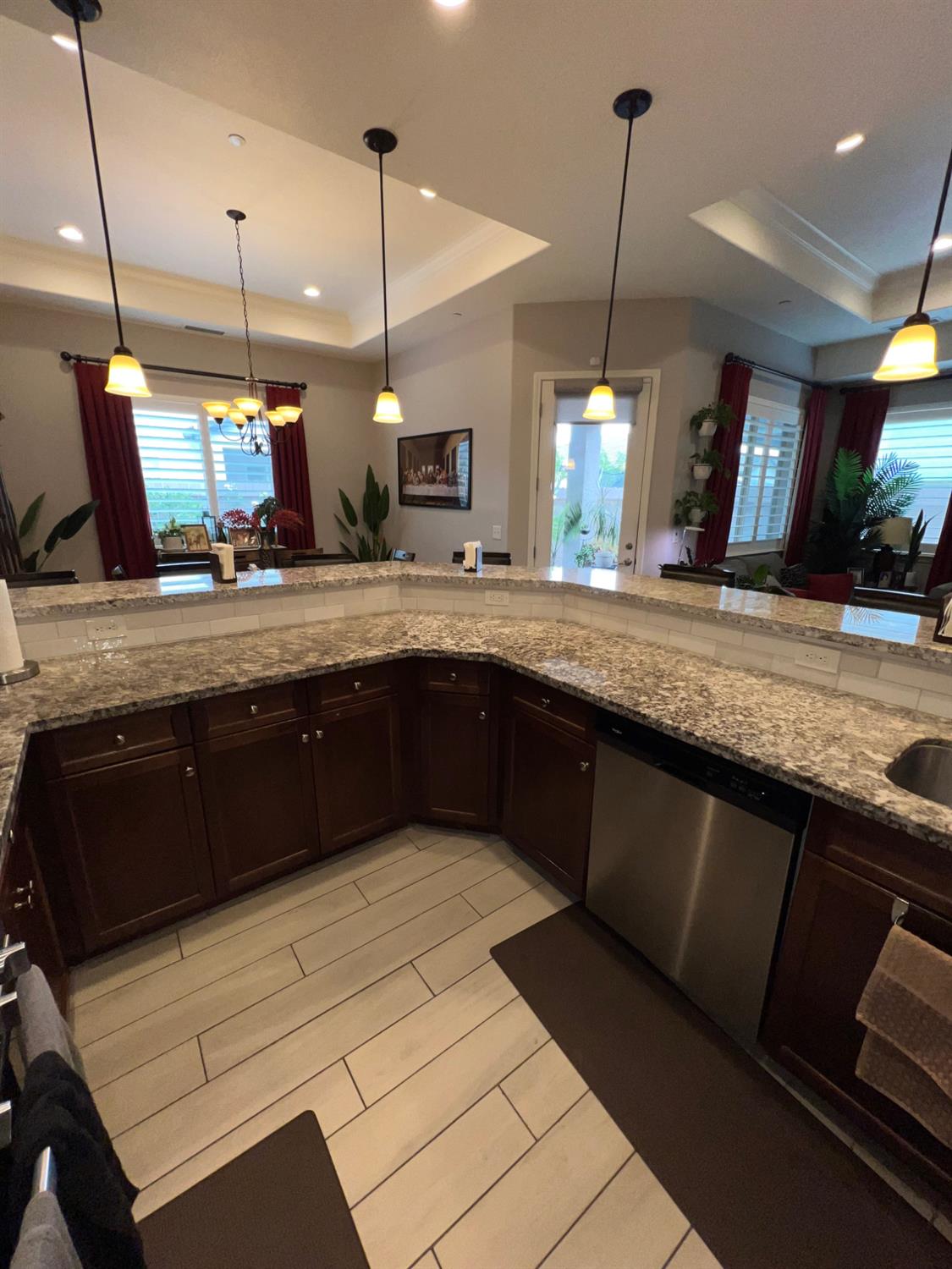 889 Coloma Place Madera, CA 93637 - Photo 14 of 61 a kitchen with a sink and wooden floor