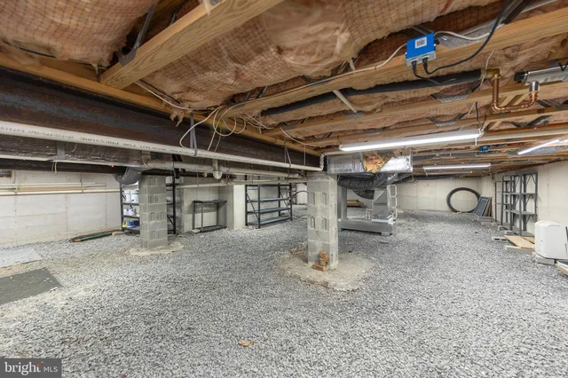 a view of empty room with wooden ceiling