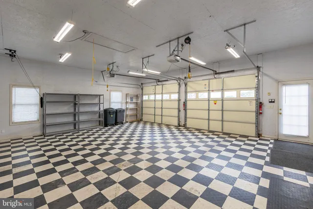 a bathroom with a black white checkered floor