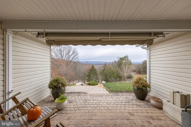 a view of a porch with furniture