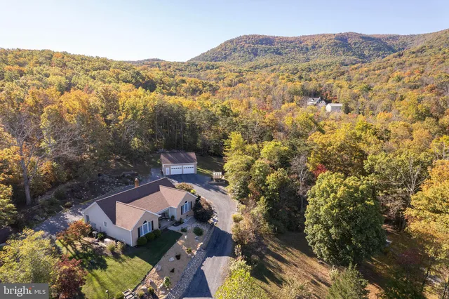 an aerial view of residential house with parking space