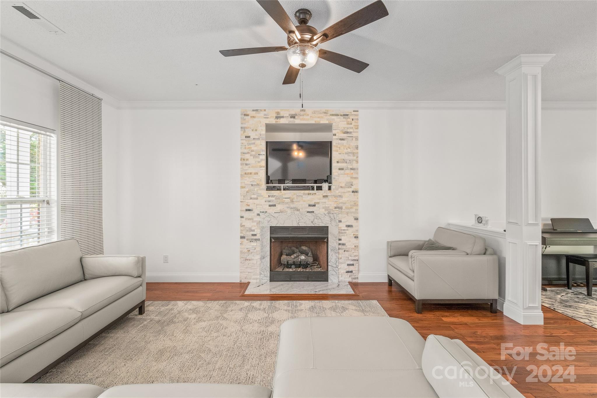 3008 Viola Lane Monroe, NC 28110 - Photo 11 of 36 a living room with furniture and a fireplace
