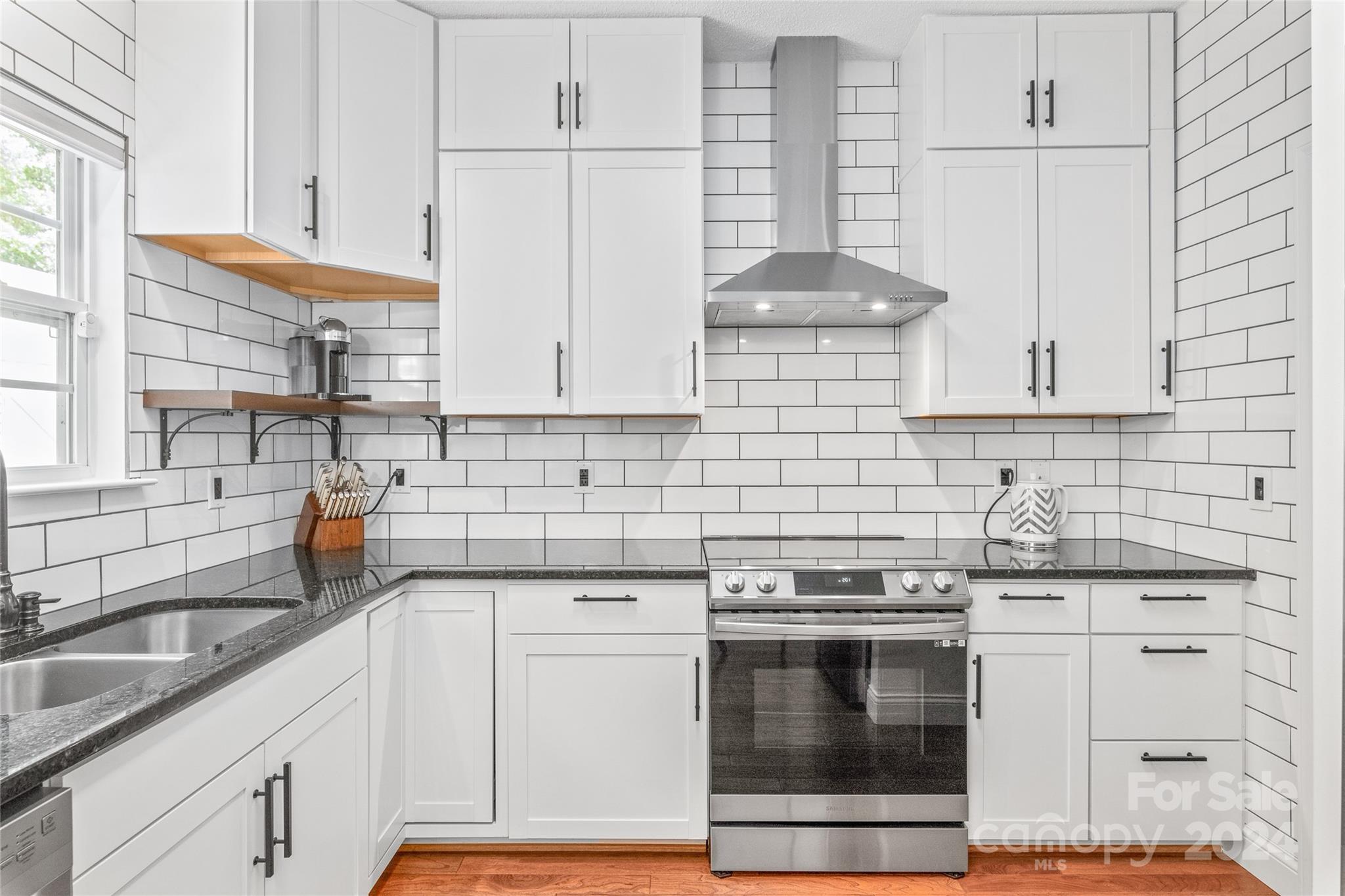3008 Viola Lane Monroe, NC 28110 - Photo 17 of 36 a kitchen with granite countertop white cabinets and white appliances