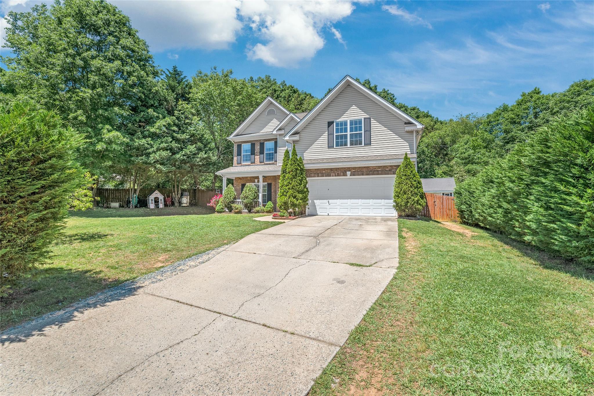 3008 Viola Lane Monroe, NC 28110 - Photo 2 of 36 a front view of a house with a yard