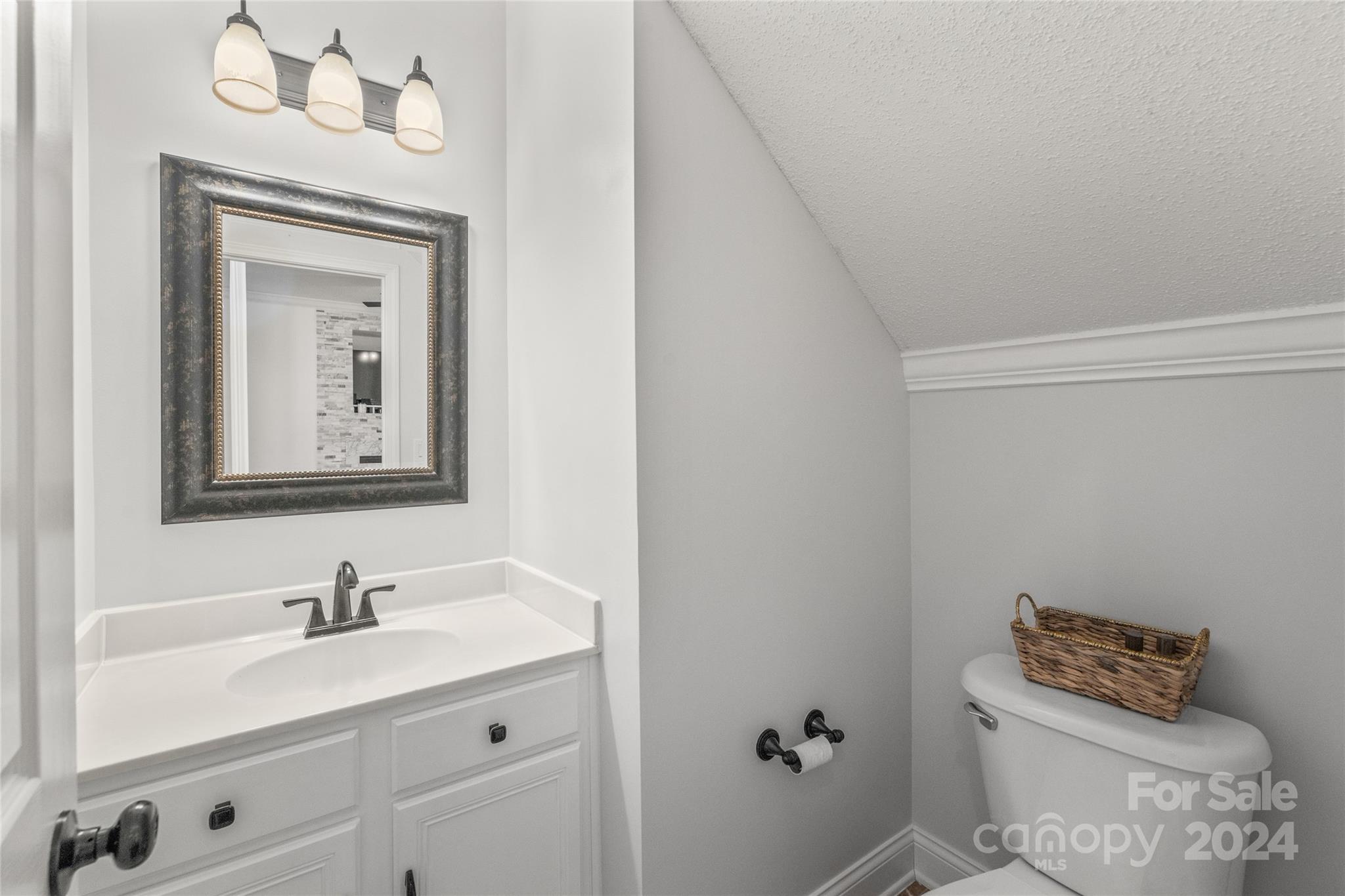 3008 Viola Lane Monroe, NC 28110 - Photo 22 of 36 a bathroom with a toilet a sink and mirror
