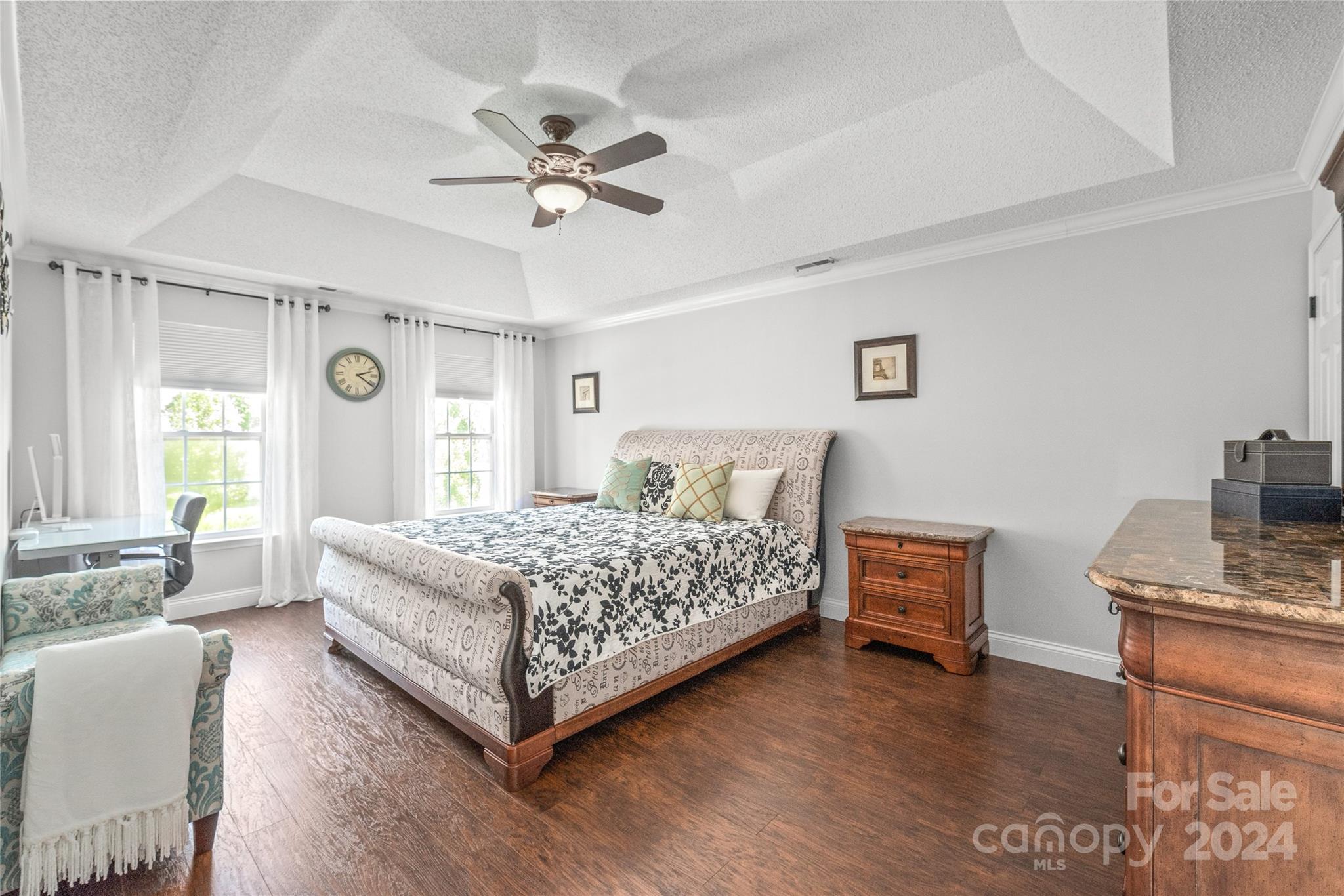3008 Viola Lane Monroe, NC 28110 - Photo 24 of 36 a bedroom with a bed and a chandelier