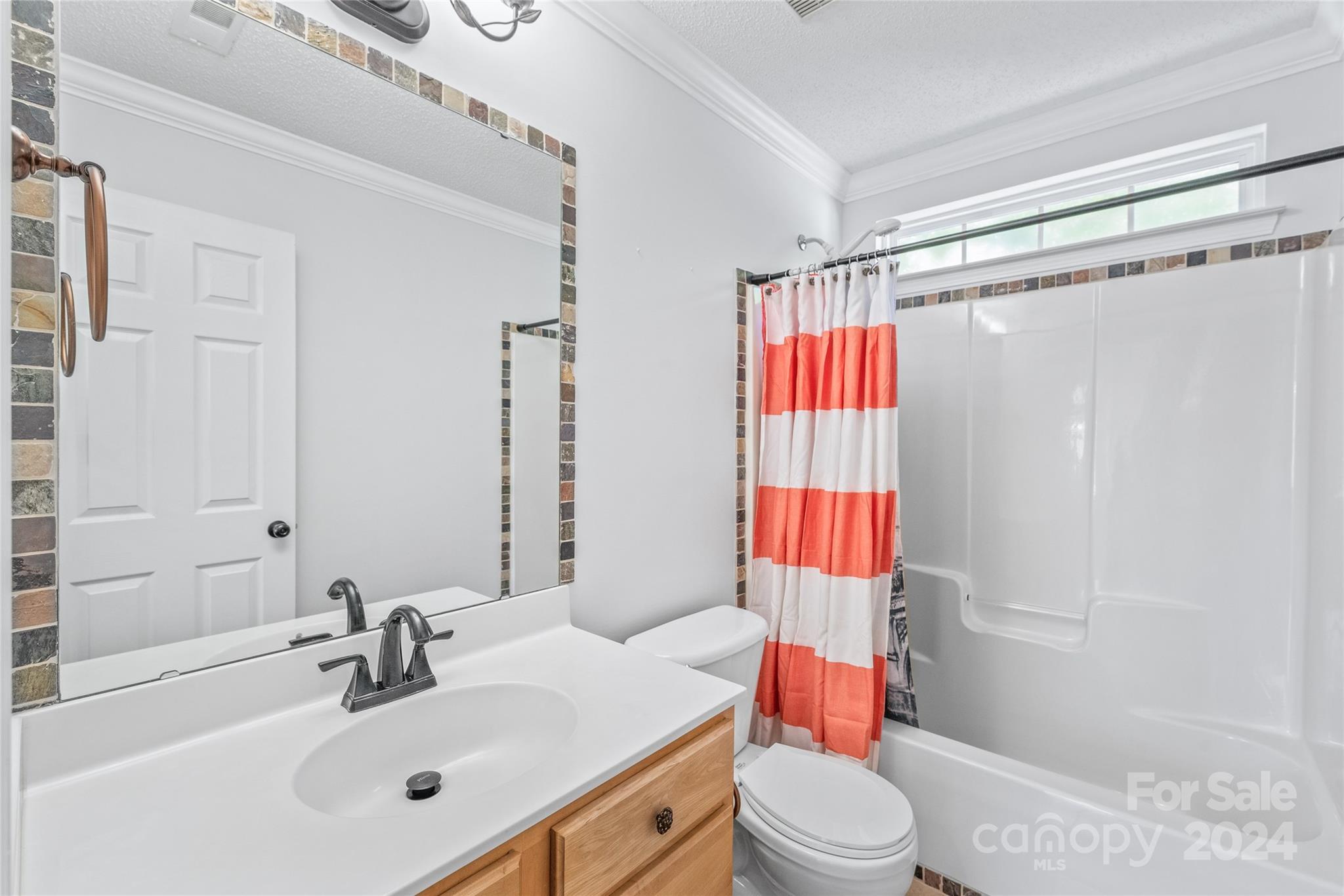 3008 Viola Lane Monroe, NC 28110 - Photo 28 of 36 a bathroom with a sink toilet and shower