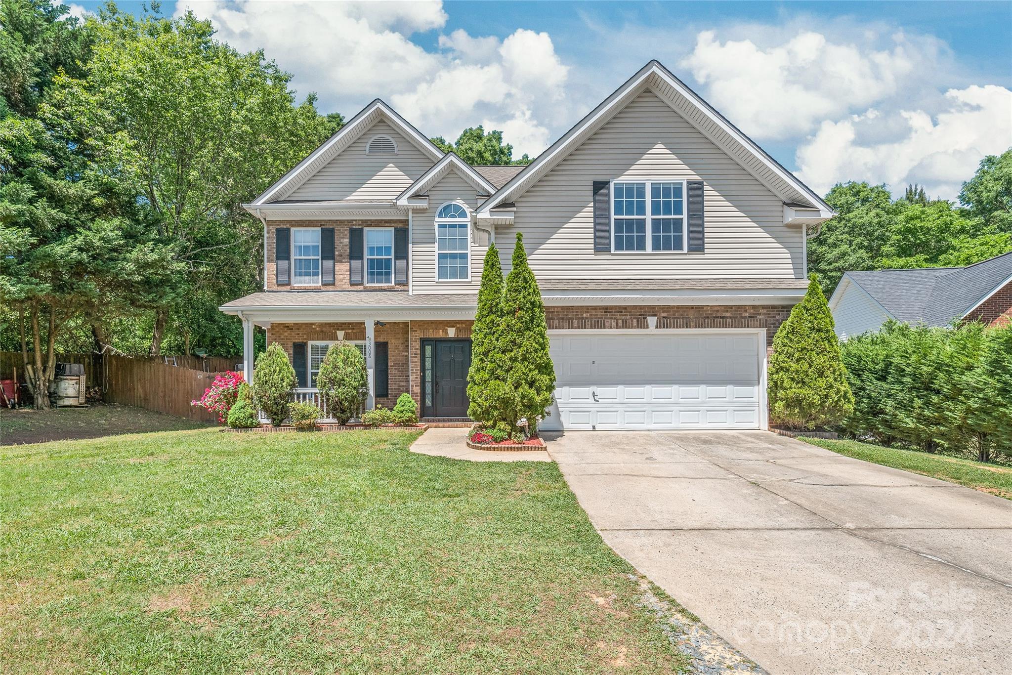 3008 Viola Lane Monroe, NC 28110 - Photo 3 of 36 a front view of a house with a yard and trees