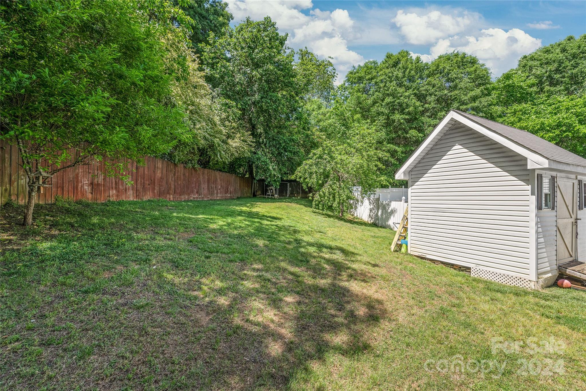 3008 Viola Lane Monroe, NC 28110 - Photo 34 of 36 a view of a backyard with a small cabin