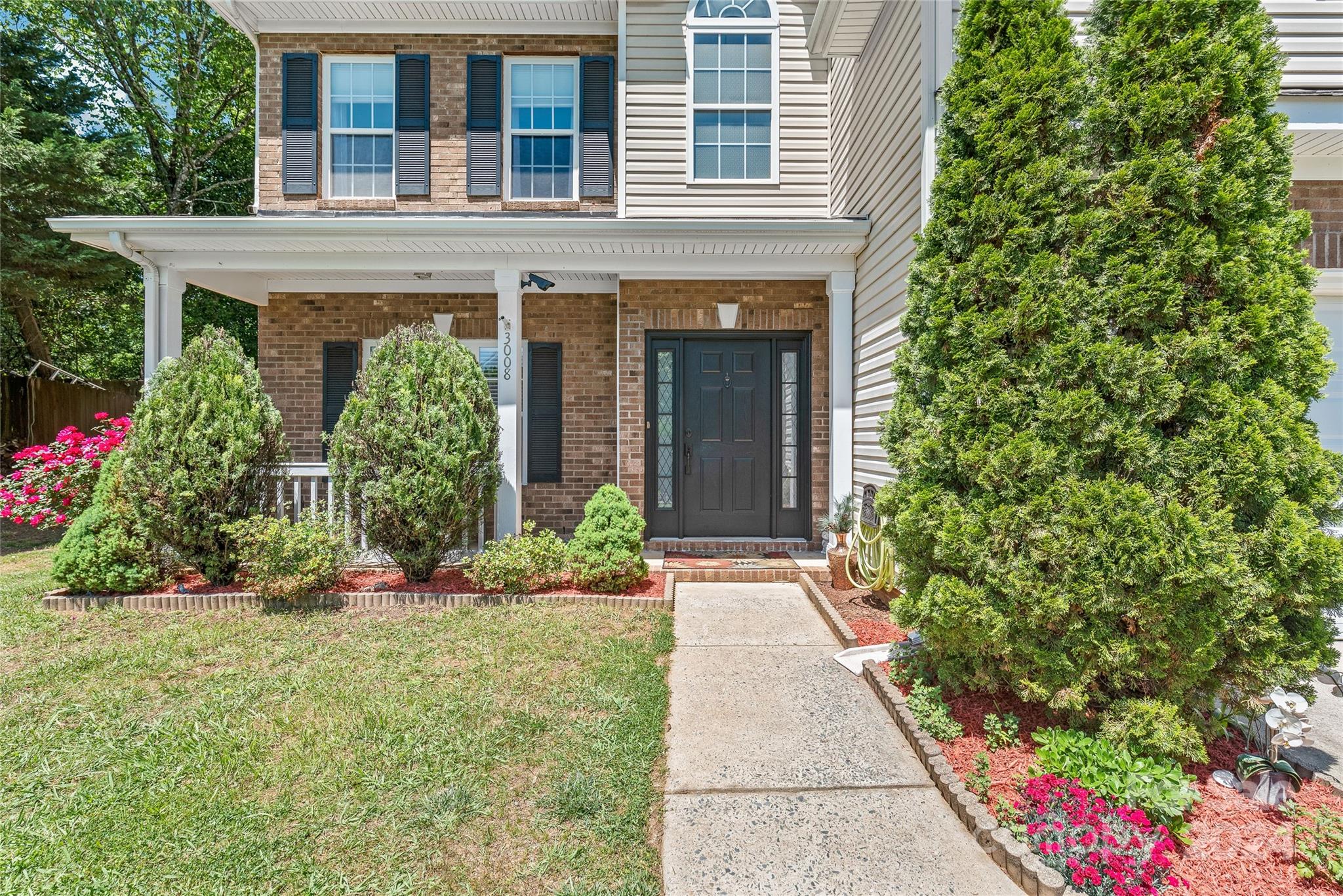 3008 Viola Lane Monroe, NC 28110 - Photo 5 of 36 front view of a house with a yard