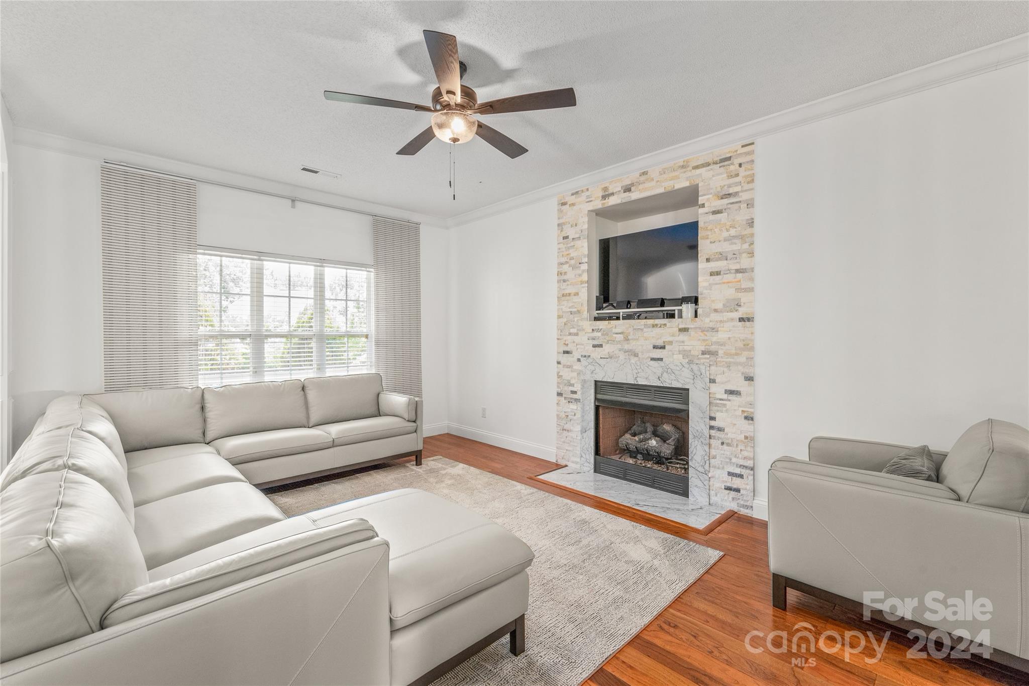 3008 Viola Lane Monroe, NC 28110 - Photo 10 of 36 a living room with furniture a window and a fireplace
