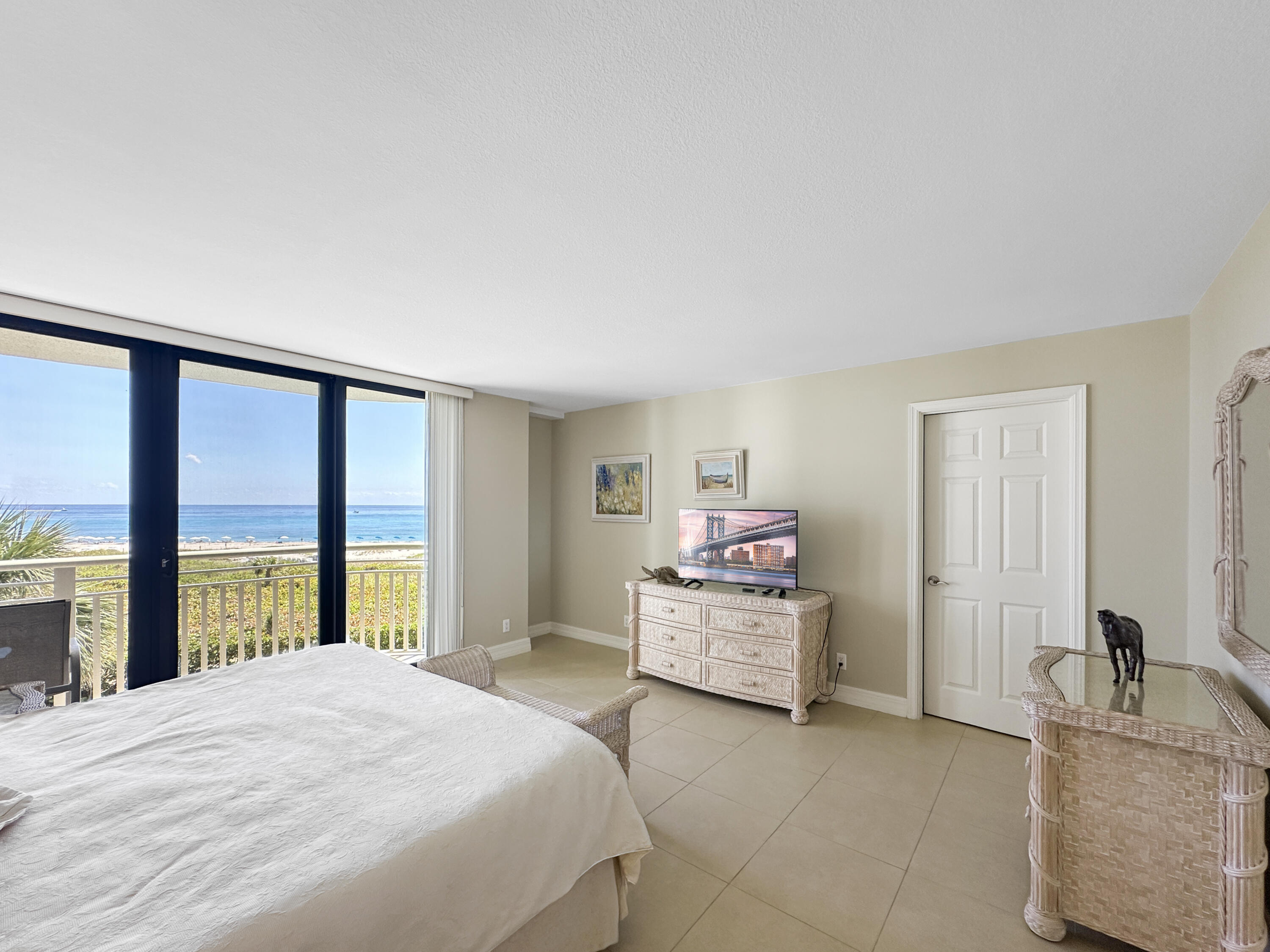 3000 North Ocean Drive, Unit 4F Riviera Beach, FL 33404 - Photo 11 of 56 a bedroom with a bed and large window