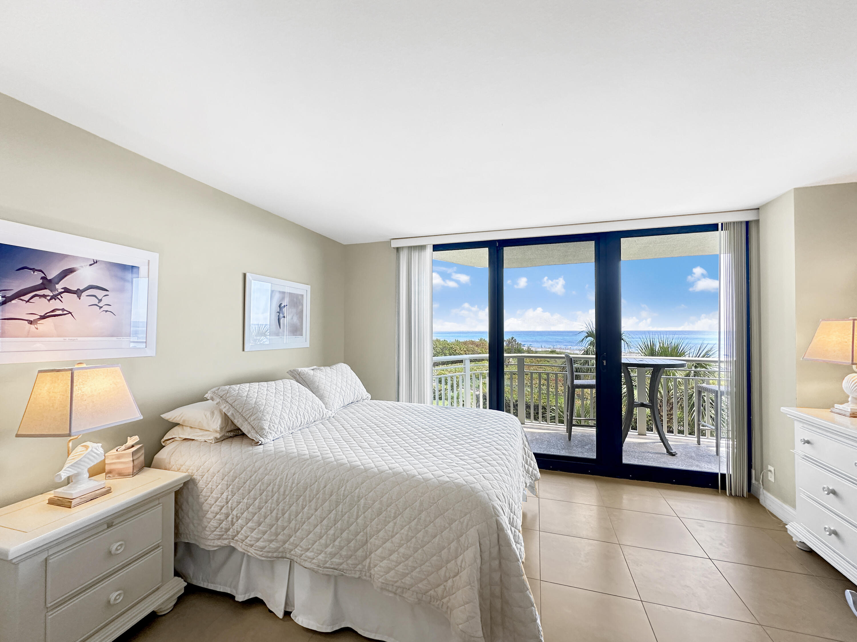 3000 North Ocean Drive, Unit 4F Riviera Beach, FL 33404 - Photo 12 of 56 a spacious bedroom with a bed and large window
