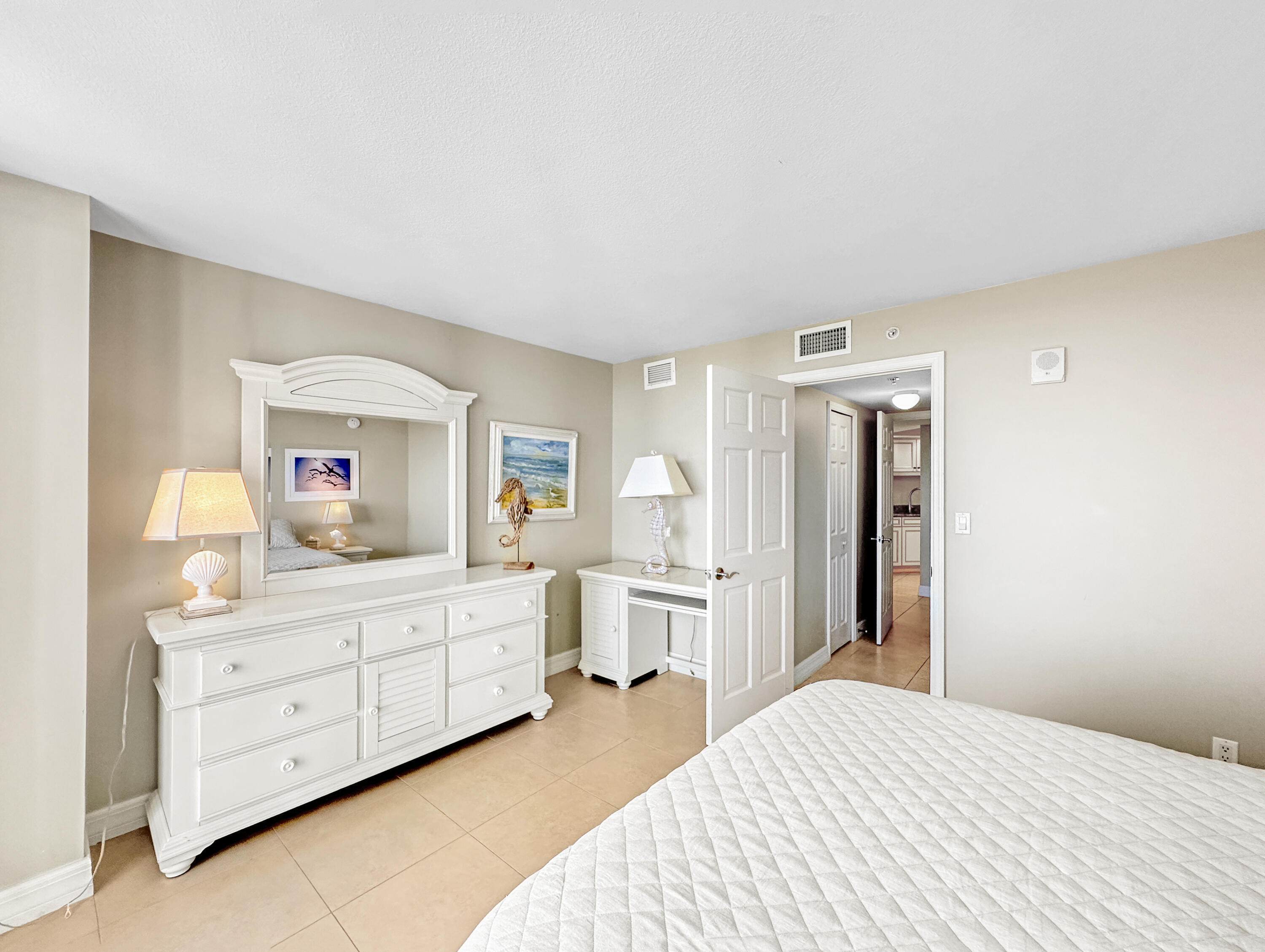 3000 North Ocean Drive, Unit 4F Riviera Beach, FL 33404 - Photo 13 of 56 a bedroom with a bed and a television in it