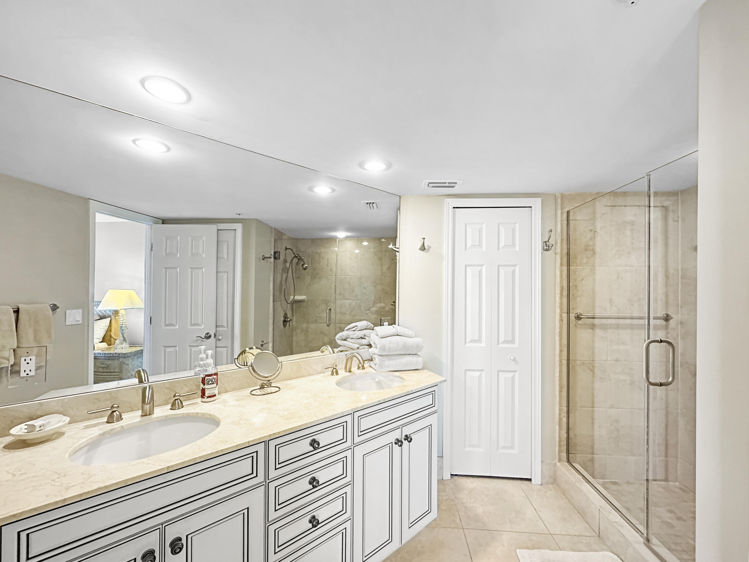 3000 North Ocean Drive, Unit 4F Riviera Beach, FL 33404 - Photo 15 of 56 a bathroom with a double vanity sink mirror and double
