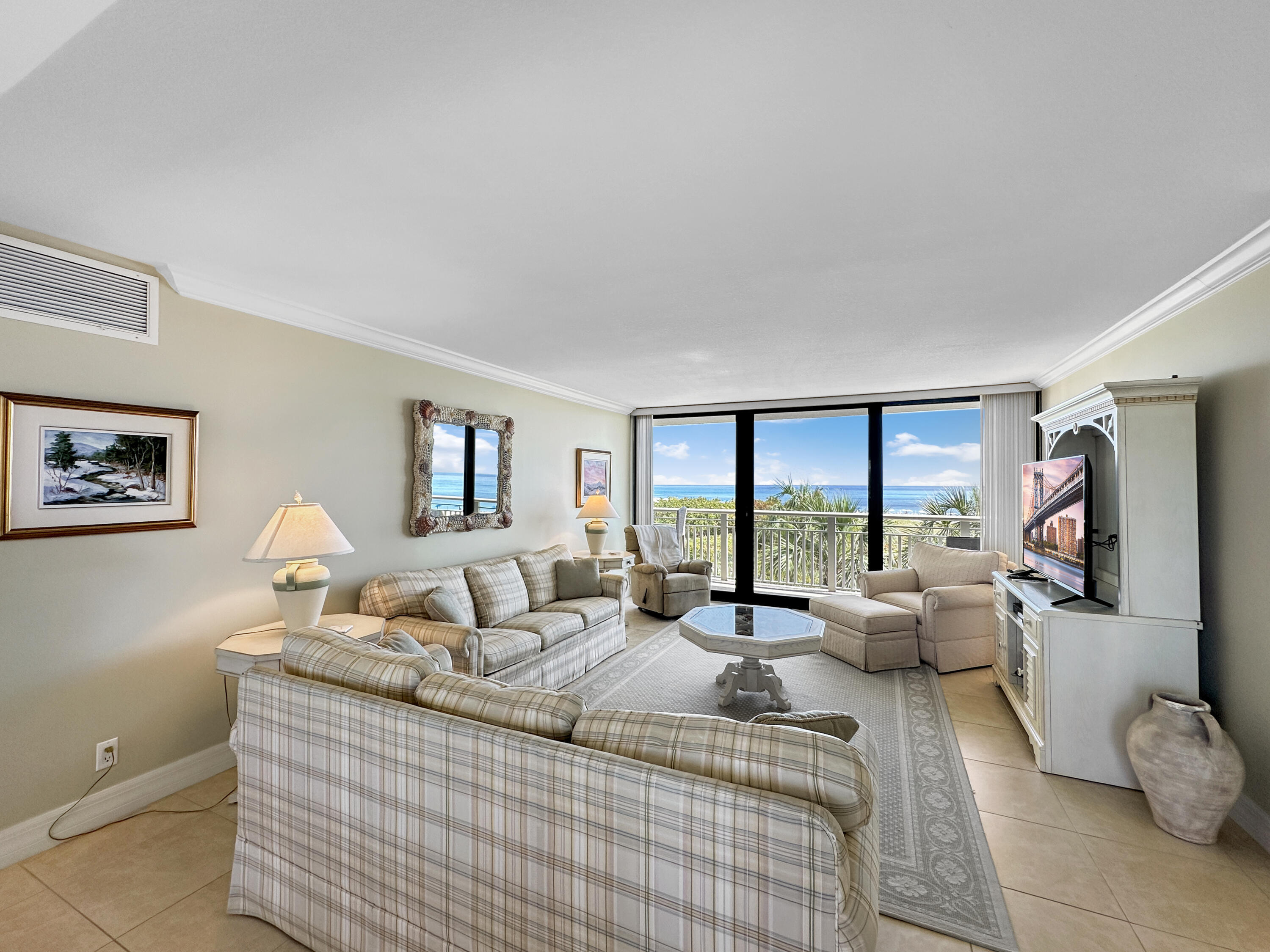 3000 North Ocean Drive, Unit 4F Riviera Beach, FL 33404 - Photo 4 of 56 a bedroom with furniture and large windows