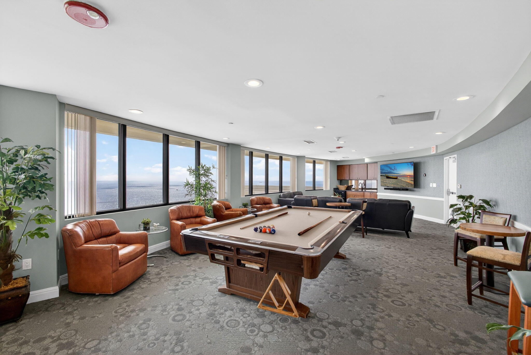 3000 North Ocean Drive, Unit 4F Riviera Beach, FL 33404 - Photo 50 of 56 a living room with furniture a table and a large window