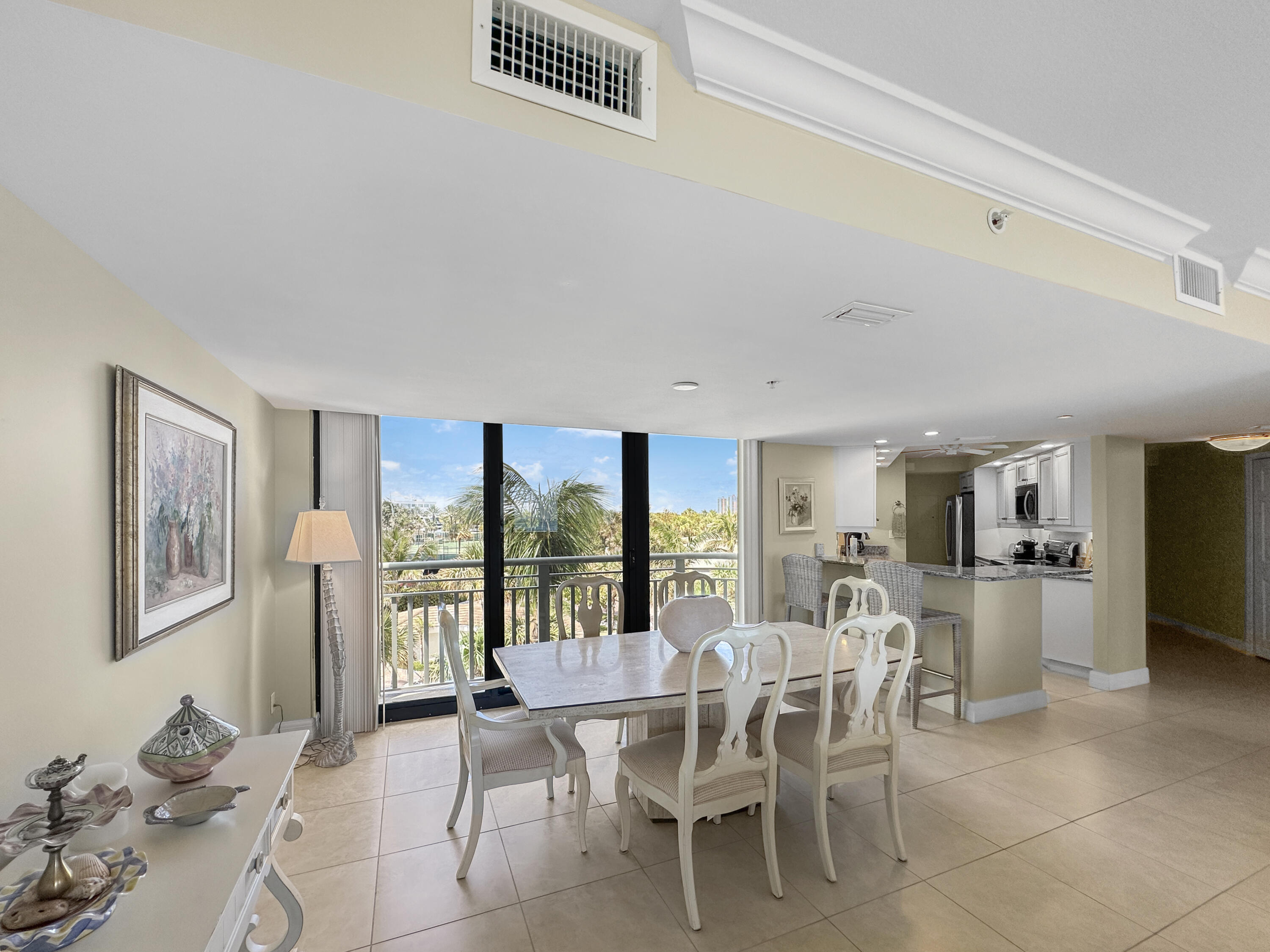3000 North Ocean Drive, Unit 4F Riviera Beach, FL 33404 - Photo 9 of 56 a dining room with furniture and window