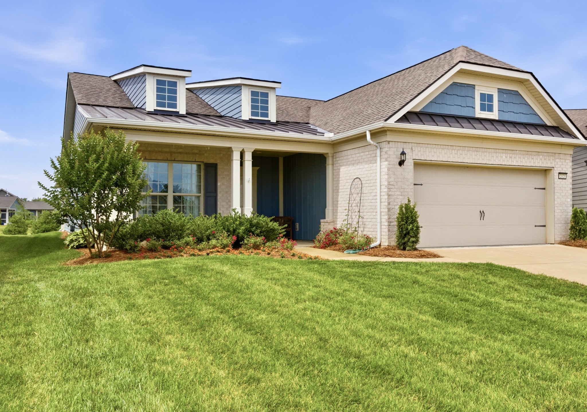 2321 Lawrence Ridge Spring Hill, TN 37174 - Photo 2 of 59 a front view of a house with a yard and garage