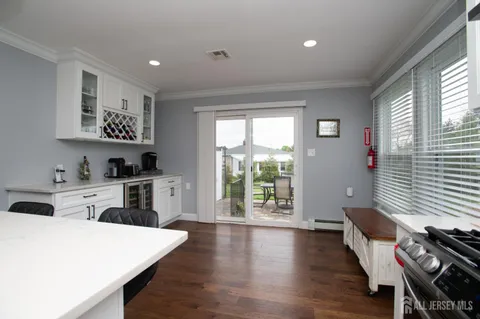 a open kitchen with sink cabinets and wooden floor