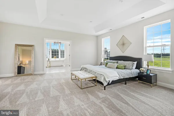 a bedroom with a bed and chair
