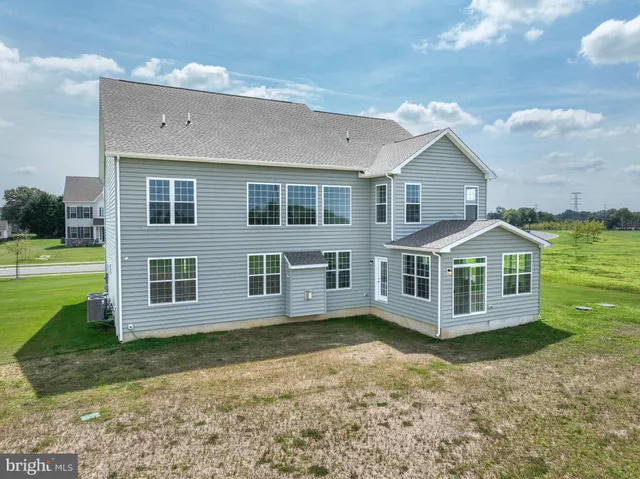 a view of entryway dining room and hall with wooden floor