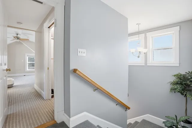a view of a kitchen with a refrigerator and cabinets