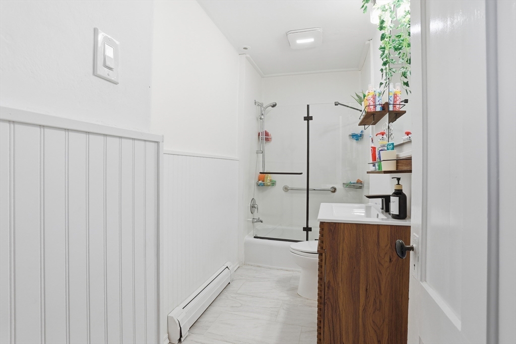 8 Perham Street Chelmsford, MA 01824 - Photo 18 of 28 a view of a kitchen with a refrigerator and cabinets