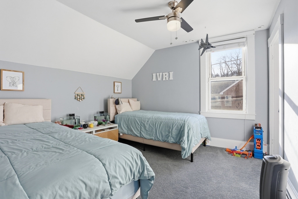 8 Perham Street Chelmsford, MA 01824 - Photo 19 of 28 a bedroom with two beds and windows