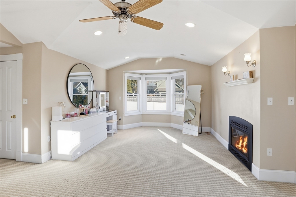 8 Perham Street Chelmsford, MA 01824 - Photo 22 of 28 a living room with furniture and a fireplace