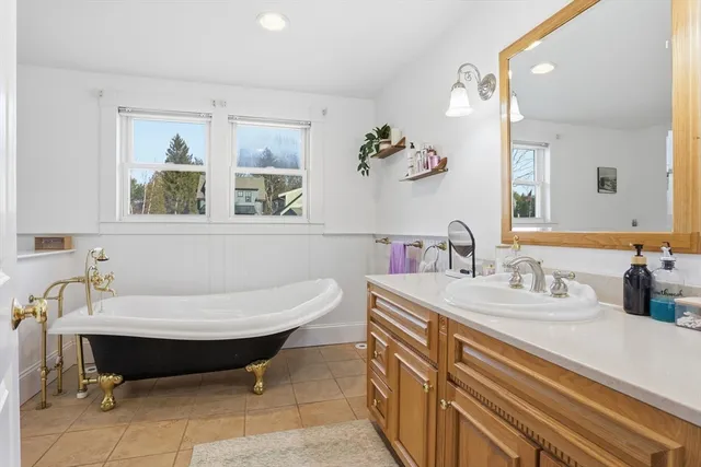 a bedroom with a bed and a television