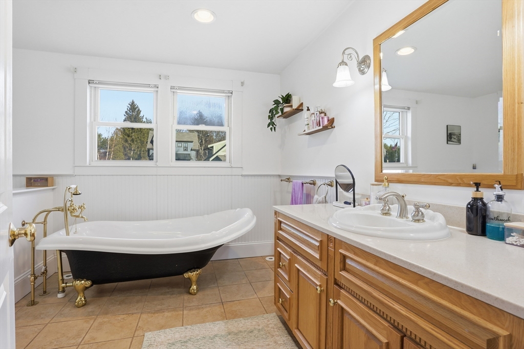 8 Perham Street Chelmsford, MA 01824 - Photo 23 of 28 a bathroom with a sink and a mirror