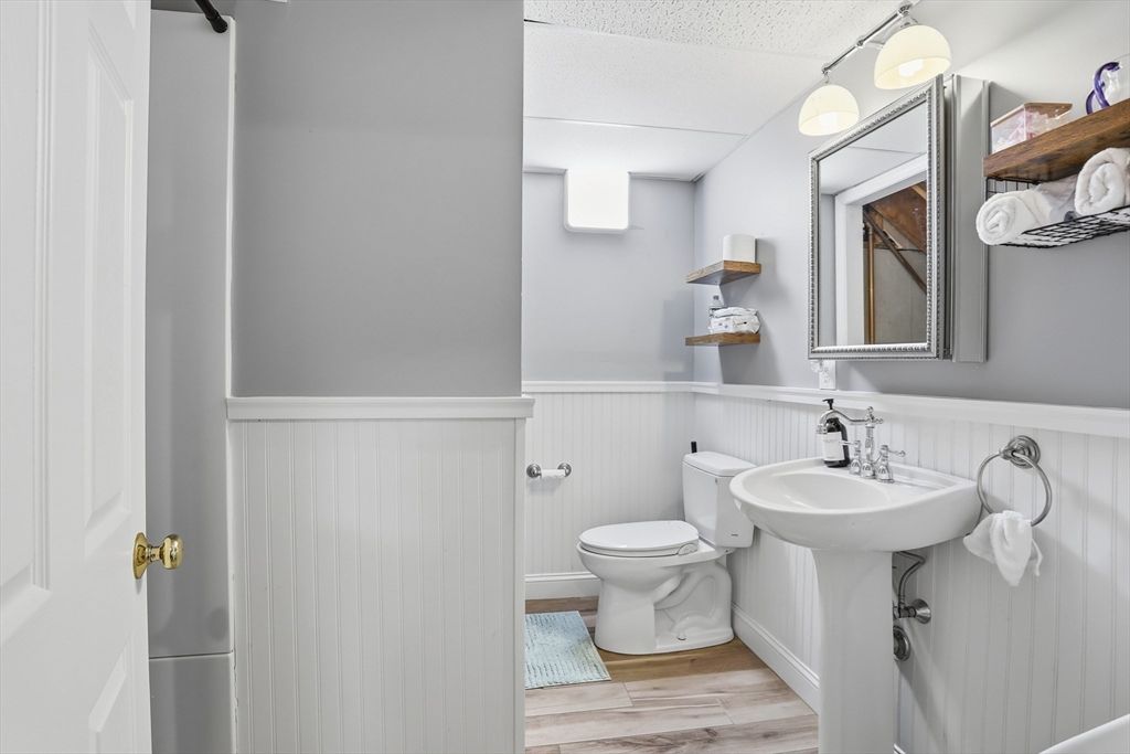 8 Perham Street Chelmsford, MA 01824 - Photo 27 of 28 a bathroom with a sink toilet and mirror