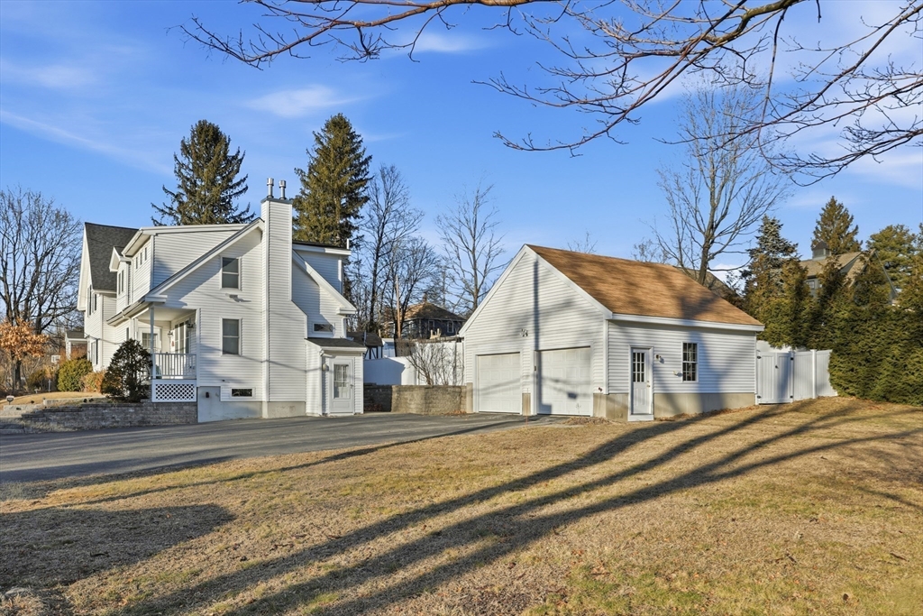 8 Perham Street Chelmsford, MA 01824 - Photo 3 of 28 a view of a white house with a large tree