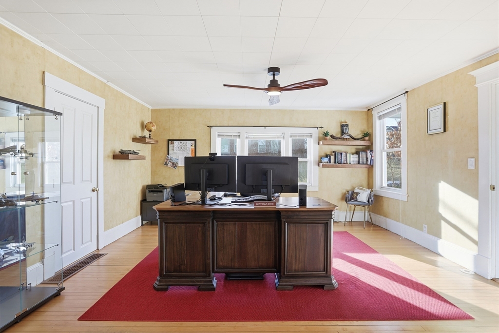 8 Perham Street Chelmsford, MA 01824 - Photo 10 of 28 a view of a workspace with furniture and wooden floor